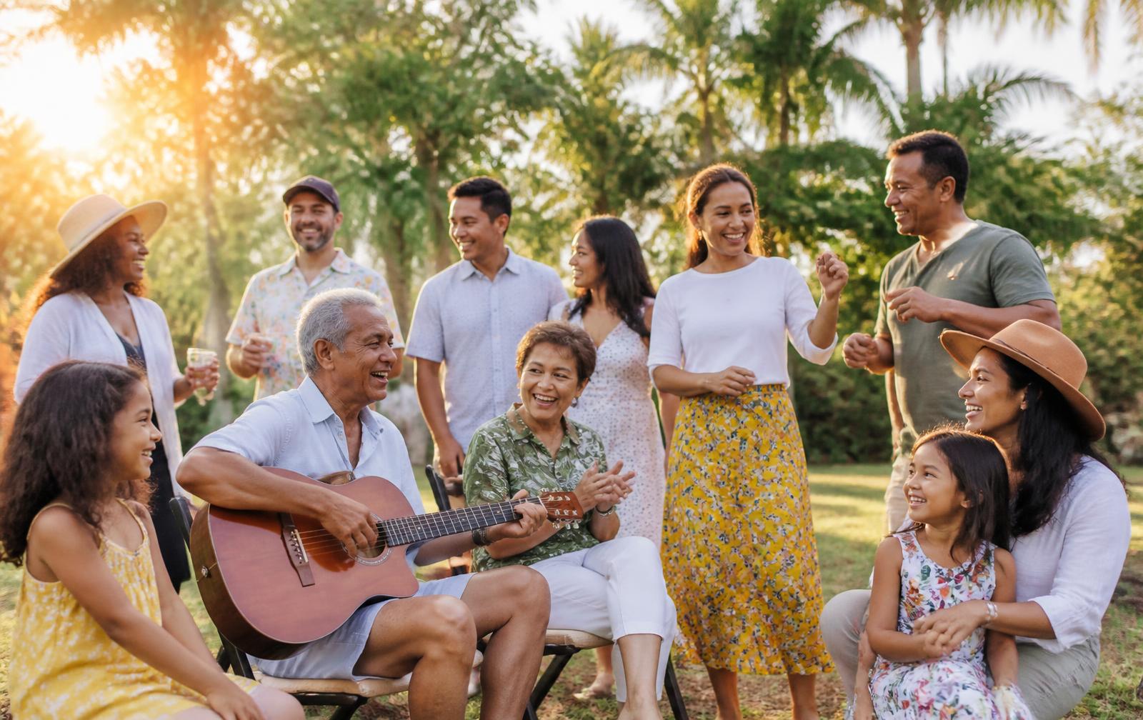 A group of adults laughing together while listening to music